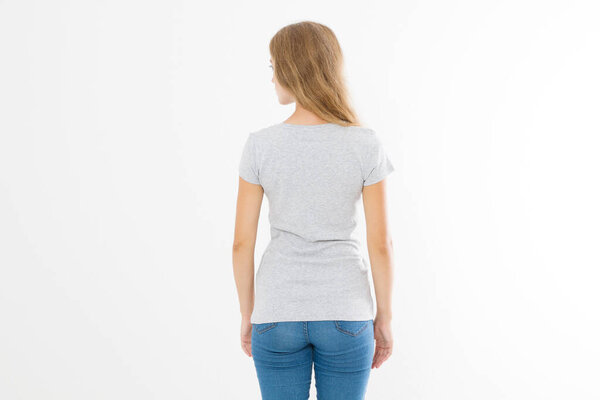 Woman in template blank t shirt isolated on white background. Back view. Mock up. Copy space.
