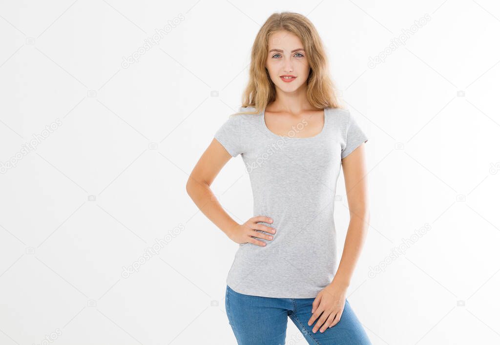 Young blonde woman with fit slim body in blank template t shirt and jeans isolated on white background. Skin and hair care. Copy space and mock up
