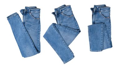 Denim, izole edilmiş, katlanmış kot pantolon kolajı beyazın üzerine.
