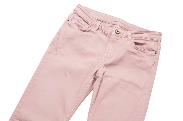 女性のパンツ 薄いピンクのデニムパンツトップビューは白の背景に隔離され 折り畳まれたスリムパンツ — ストック写真
