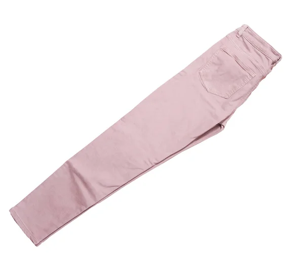 女性のパンツ 薄いピンクのデニムパンツトップビューは白の背景に隔離され 折り畳まれたスリムパンツ — ストック写真