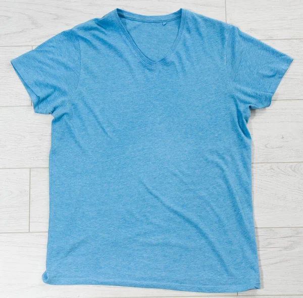 Blue t-shirt mock up top view, blue shirt copy space
