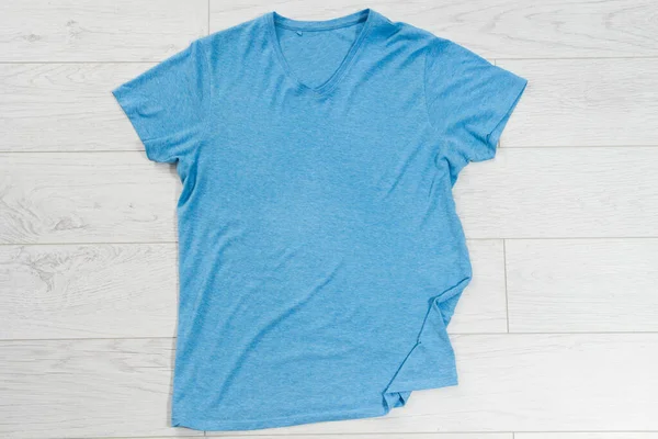 Blue t-shirt mock up top view, blue shirt copy space