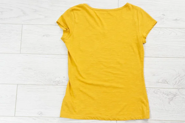 yellow tshirt mock up, yellow shirt close up - top view