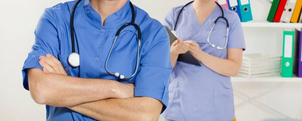 Medical people - doctor surgeon and nurse, in medical office hospital. Healthcare service.