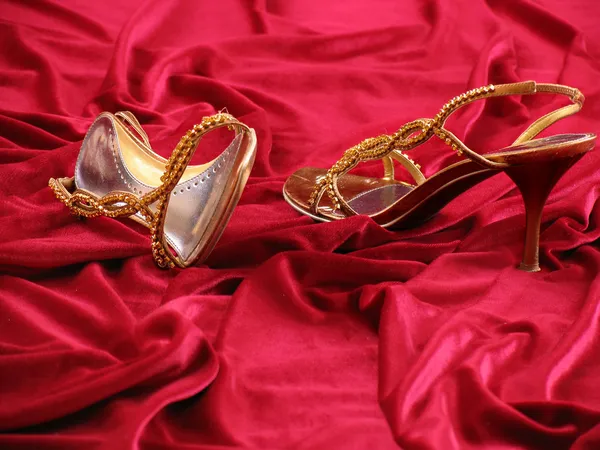 Photo of opened feminine loafer with jewels on background red velvet. — Stock Photo, Image