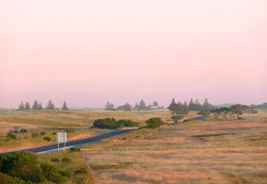 The Agricultural romantic land on sundown. Near Portland, Victoria, Australia. clipart