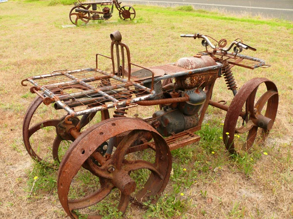 Amusing and rusty model of motorcycle (quadrocycle). Western Australia, near Albany. — Stock Photo, Image