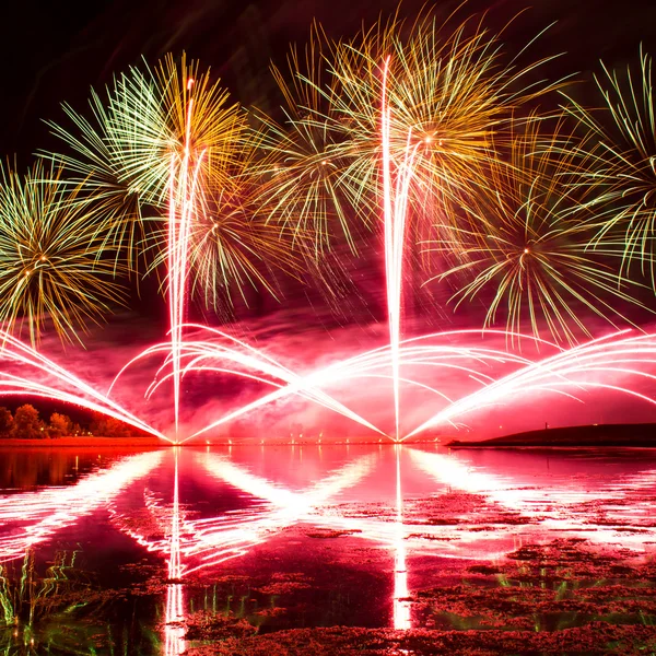 Bursts of Green, Orange and Pink Fireworks — Stock Photo, Image