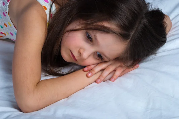 Young child, lying awake in his bed — Stock Photo, Image