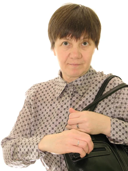 Μέσης ηλικίας γυναίκα με μια μαύρη τσάντα, σε λευκό φόντο — Φωτογραφία Αρχείου