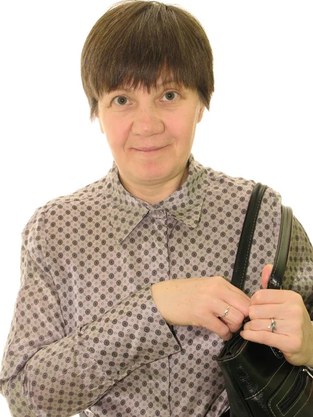 Middle-aged woman with a black bag, on a white background — Stock Photo, Image