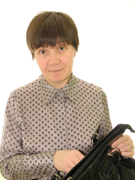 Middle-aged woman with a black bag, on a white background — Stock Photo, Image