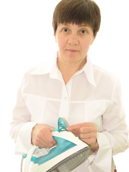 Woman with an iron — Stock Photo, Image