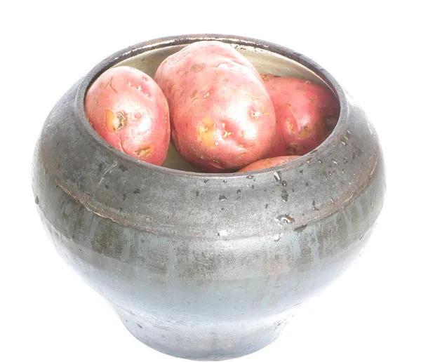 Cast iron pot with potatoes — Stock Photo, Image