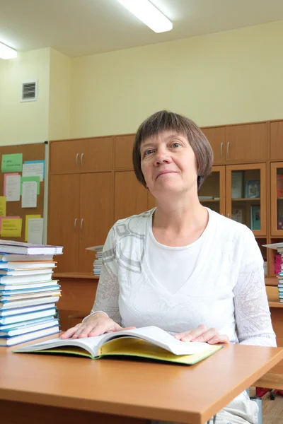 Woman teacher in the classroom Royalty Free Stock Images