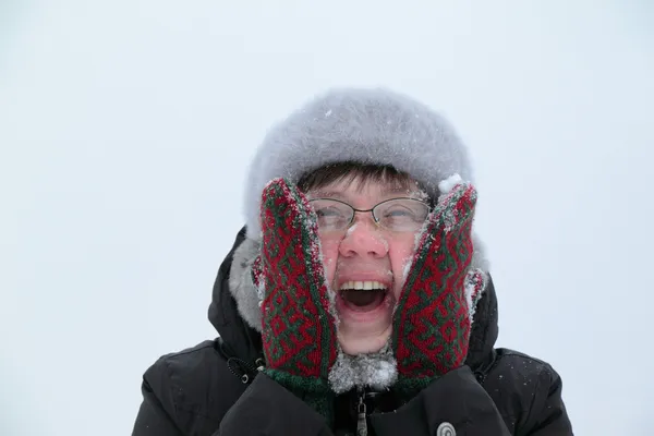 Woman rubbing snow person — Stock Photo, Image