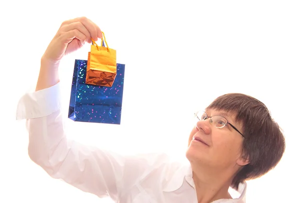 Middle-aged women with a paper gift bags — Stock Photo, Image