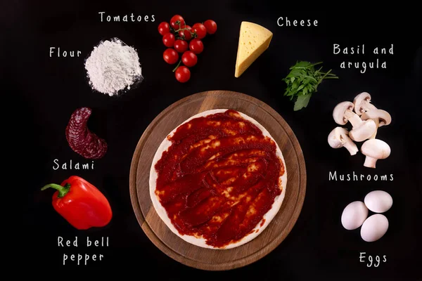 Ingredients Pizza Lie Black Background Pizza Greased Sauce Each Ingredient — стоковое фото