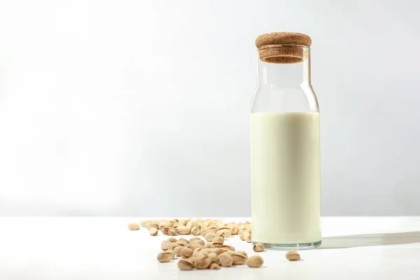 Pistachio milk on a light background with empty space for text — Fotografia de Stock