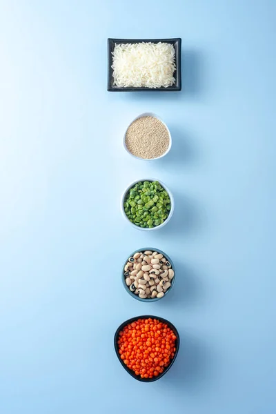 Ancient grain food superfood set. A number of superfood bowls on a white background. An alternative to food crisis products. Healthy eating forgotten grains. Ancient grain food. Flat lay