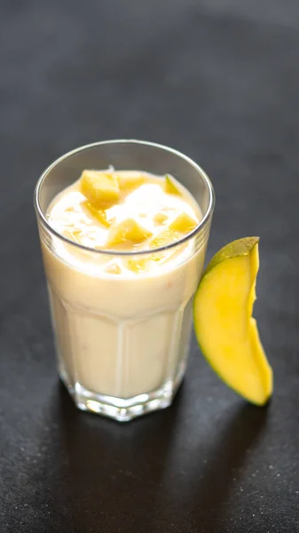 Milk Shake Black Background Mango Pieces — Stock Photo, Image
