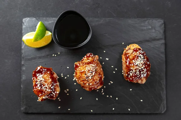 Asian food. Fast food street food. Chicken in teriyaki sauce and sesame. a traditional Japanese way of frying using a common sweet sauce in Japanese cuisine. Top view and flat lay