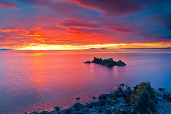 Meer und Sonnenuntergang Stockbild