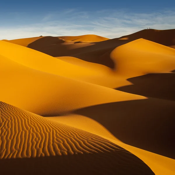 Libysche Sahara. Dünen. Sandstruktur bei Sonnenuntergang. Stockbild