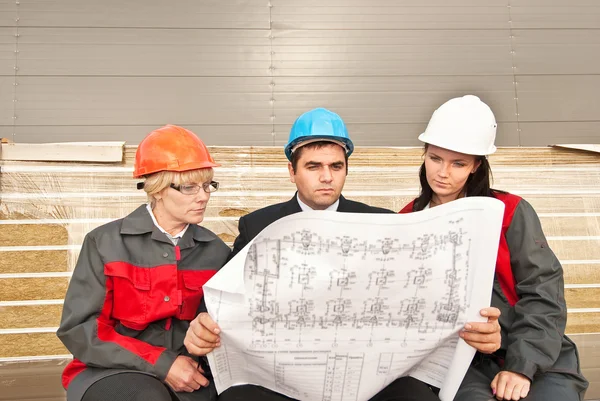 Director with subordinates on construction site — Stock Photo, Image