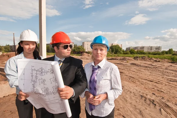 Director with subordinates on construction site — Stock Photo, Image