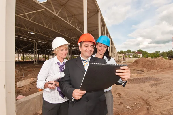 Group of engineers at construction site — Stock Photo, Image