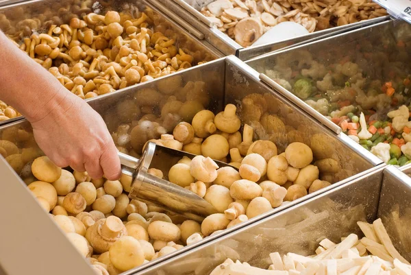 Buying frozen mushrooms — Stock Photo, Image