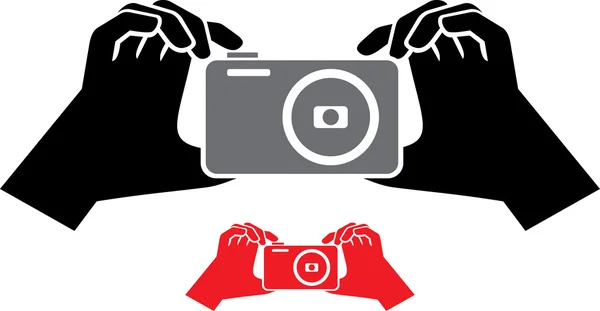 Caméra dans les mains icône — Image vectorielle