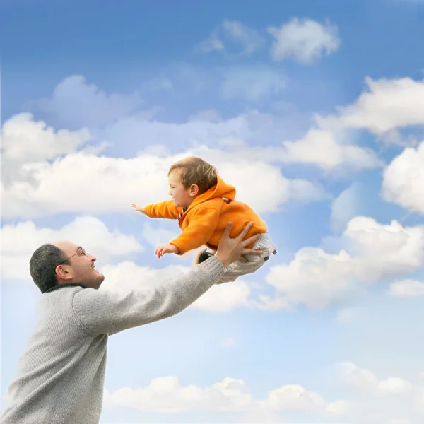 Flying child over sky background — Stock Photo, Image