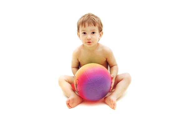 Cute toddler with colorful ball over white — Stock Photo, Image