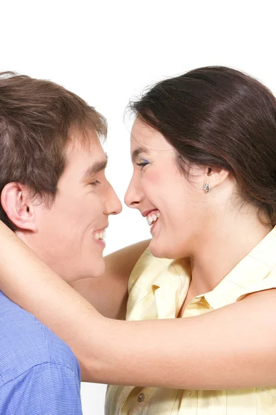 Lyckliga unga par över vita — Stockfoto