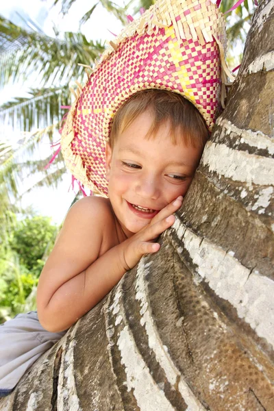 Close up portrait of happy boy on palm — Stock Photo, Image