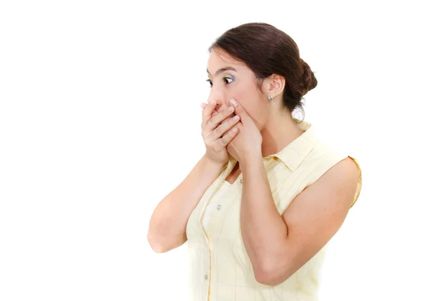 Shocked girl closing her mouth with hands over white — Stock Photo, Image