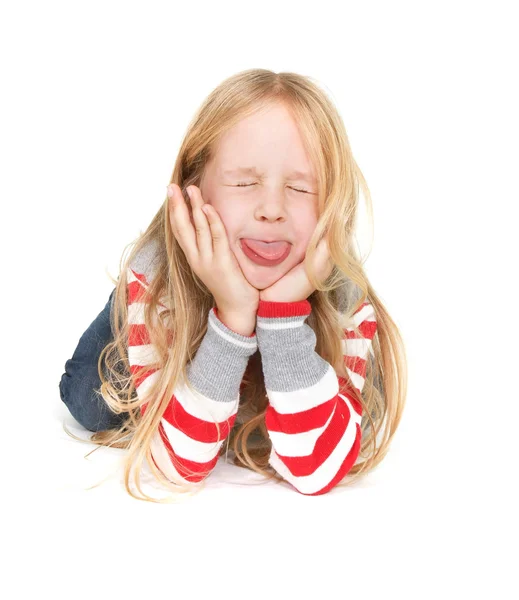 Young girl showing her tongue — Stock Photo, Image