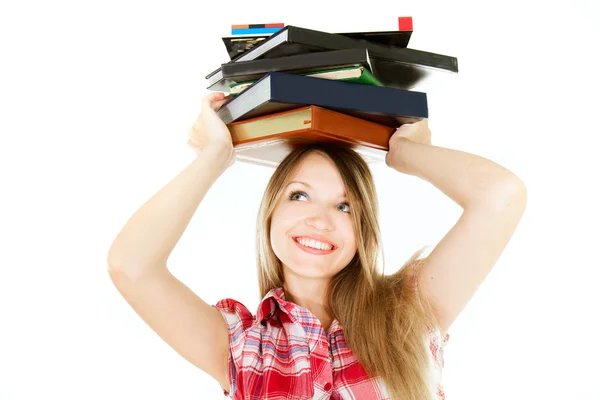 Attractive student girl with pile of book on her head over white — Stock Photo, Image