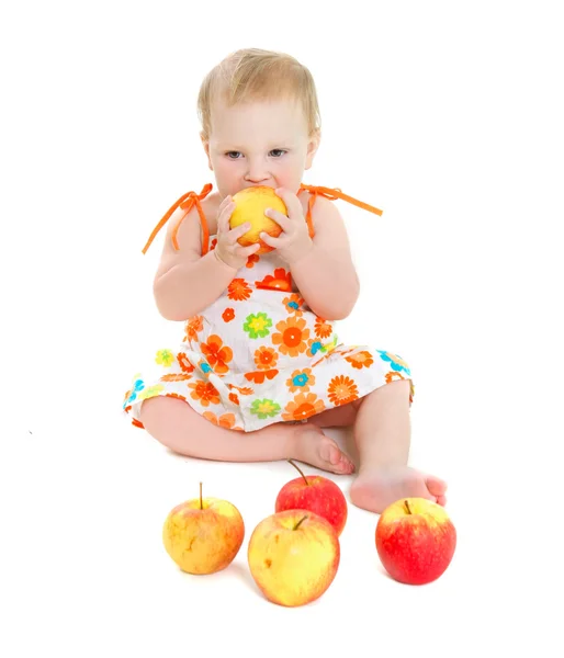 Cute baby girl with apples over white — Stock Photo, Image