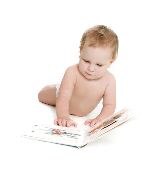 Niedliches Baby mit Buch über Weiß — Stockfoto