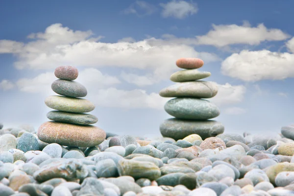 Two stacks of stones over sky background — Stock Photo, Image