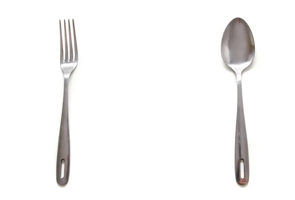 Cucchiaio e forchetta su bianco — Foto Stock