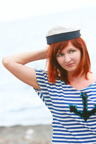 Sad girl in sailor's vest on sea background — Stock Photo, Image