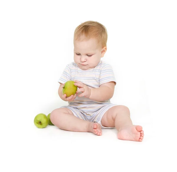 Cute toddler with apples over white — Stock Photo, Image