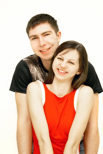 Jovem casal feliz sobre branco — Fotografia de Stock