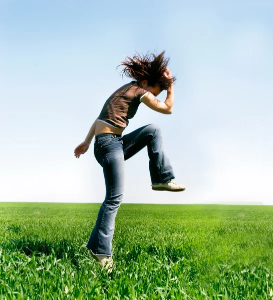 Jumping girl on natural background — Stock Photo, Image