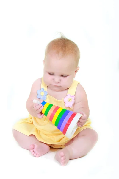 Bonito bebê menina com brinquedo sobre branco — Fotografia de Stock